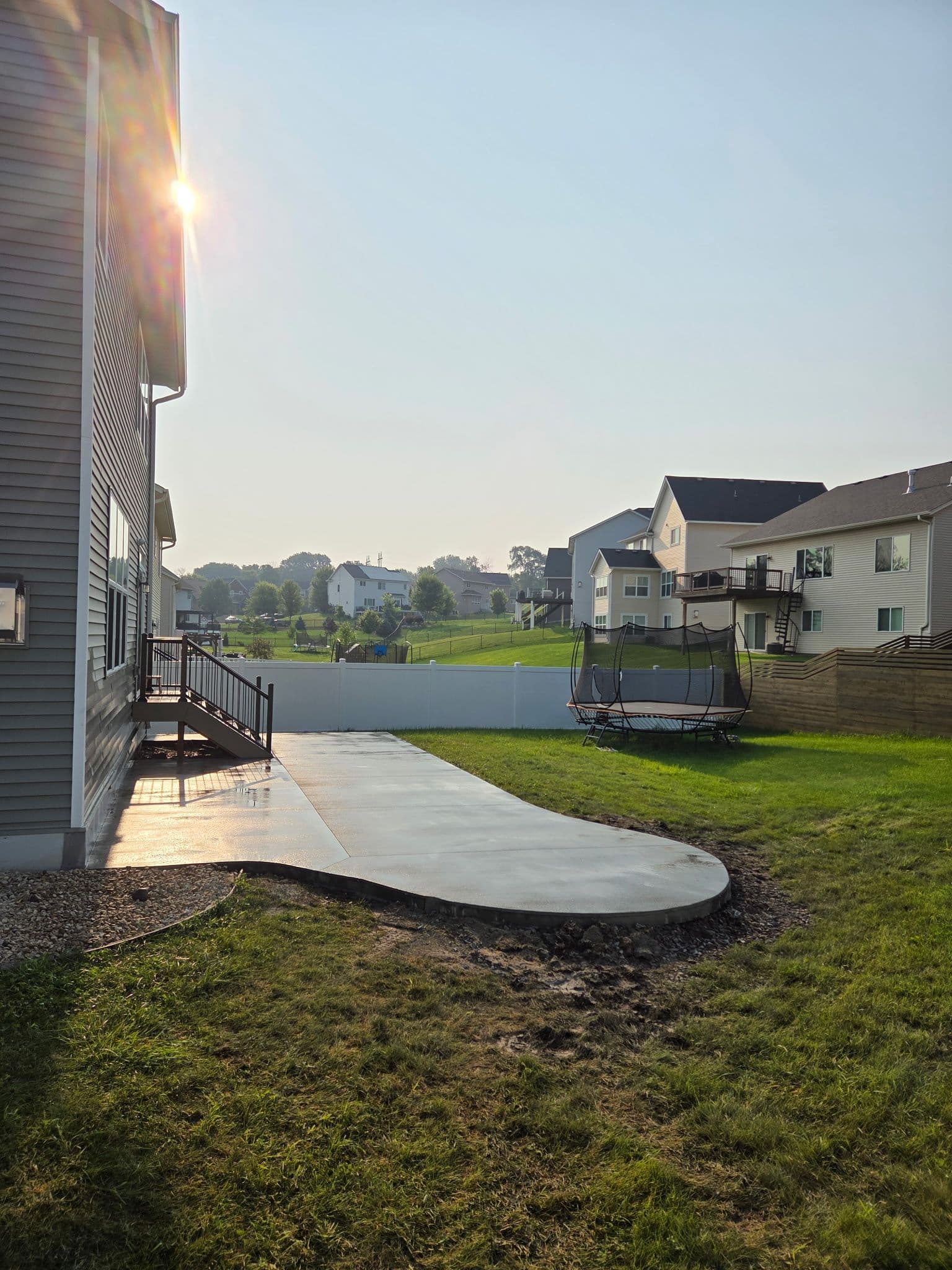 Gray Concrete Patio Installation for a Mud-Free Backyard image